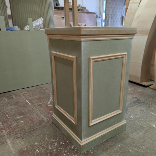 Beaded plinth with extra design